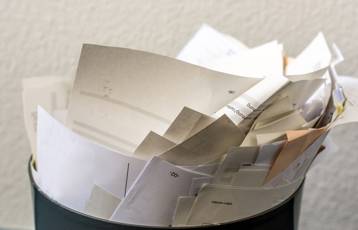 Confidential papers in a garbage can instead of confidential data destruction.