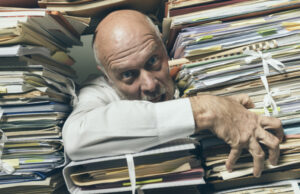 Man trying to get through huge piles of files has questions about data compliance.