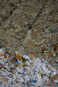 Data destruction takes many forms like pierce and tear document shredding shown in this picture.