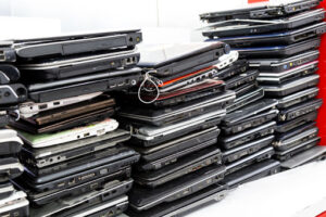 Stacks of old laptops like these might create a data breach risk.