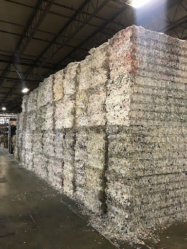 Considering shredding services? Pictured: Stacks of processed shredded material.